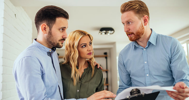 Stock Photo Of A Dealer Selling To A Couple Representing Commercial Dealers of Rollac Products