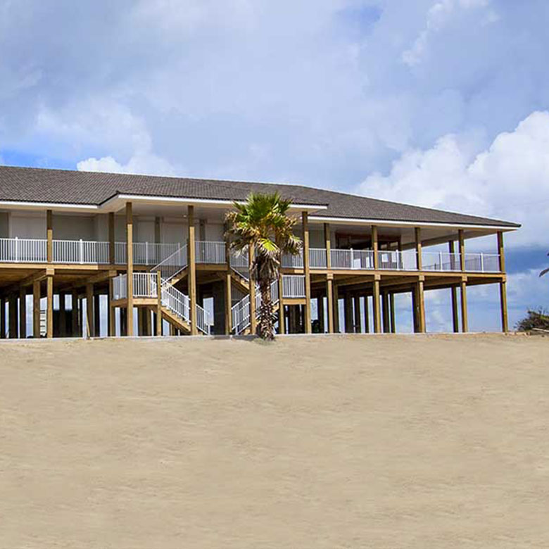 Wide Shot of Beach House Using Rollac's Rolling Shutters Across All Windows