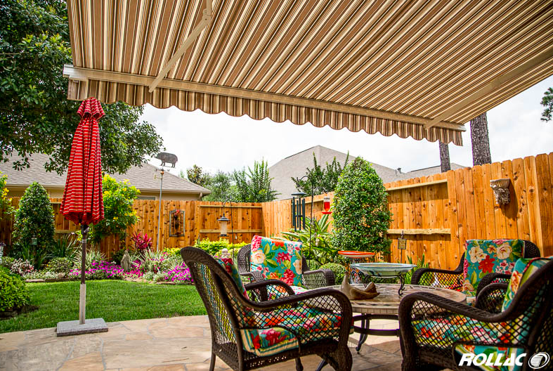Rollac Retractable Awning Over a Backyard Patio With Furniture