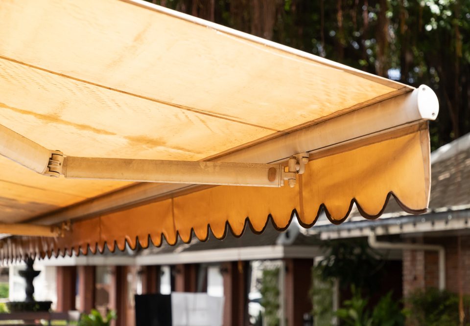 Dusty yellow awnings that need to be cleaned