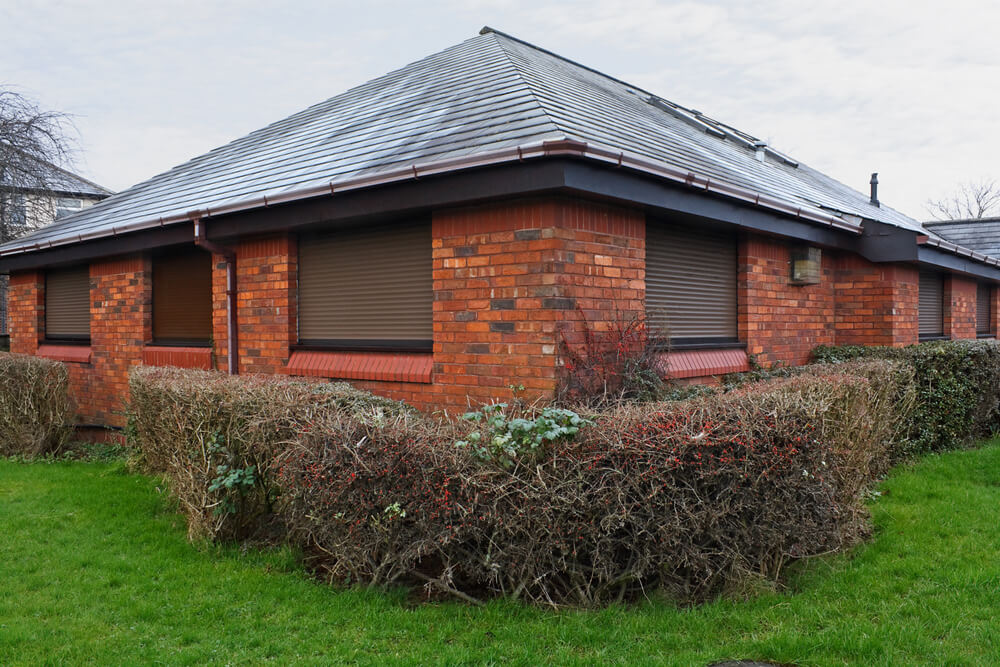 Panoramic view of a house with roller shutters installed on the windows
