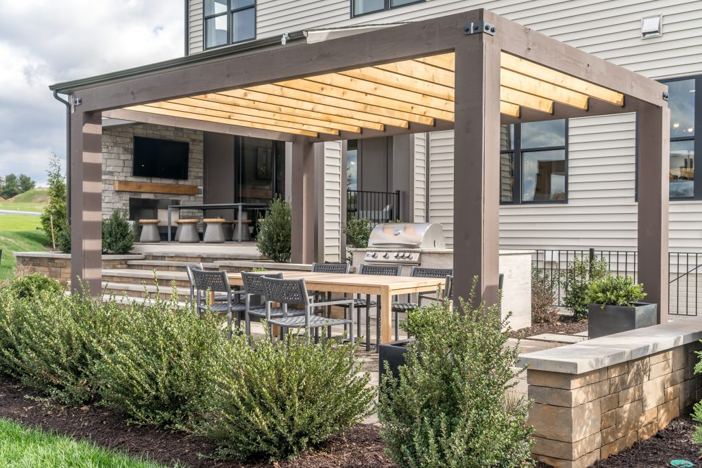  West Facing Backyard Patio with a Trendy Pergola Shade Structure