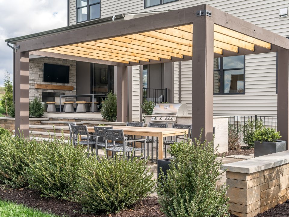 West Facing Backyard Patio with a Trendy Pergola Shade Structure