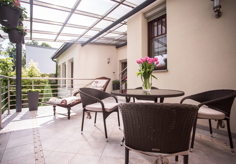 Cozy balcony with wicker furniture