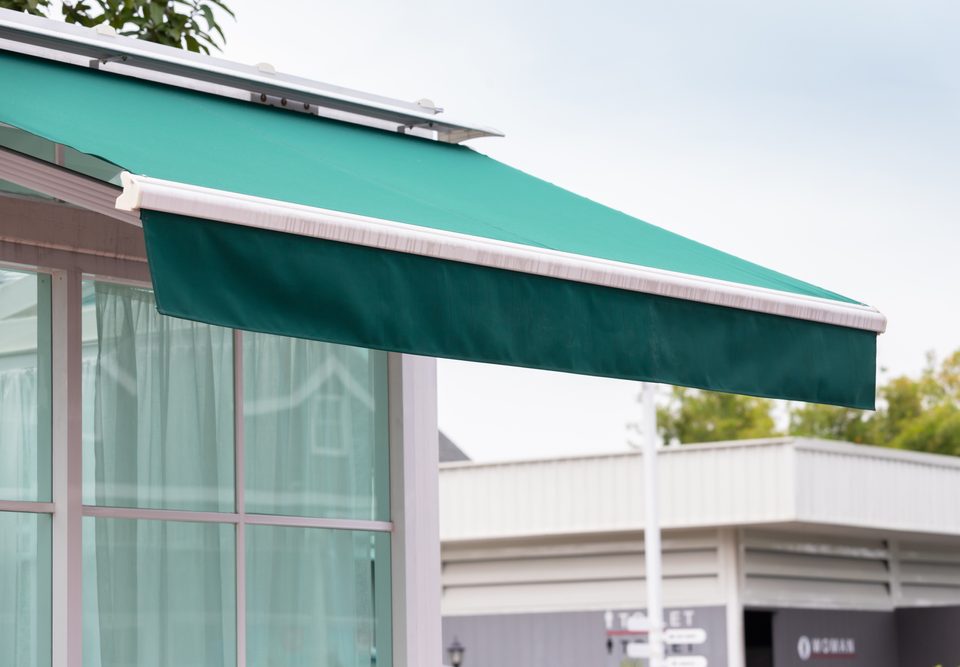 Green awning properly sized to fit a window