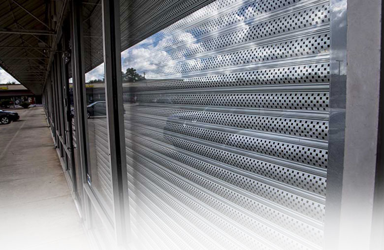 Rollac Single Wall Extruded Shutter System Allowing for Visibility and Protection Lowered on Commercial Window
