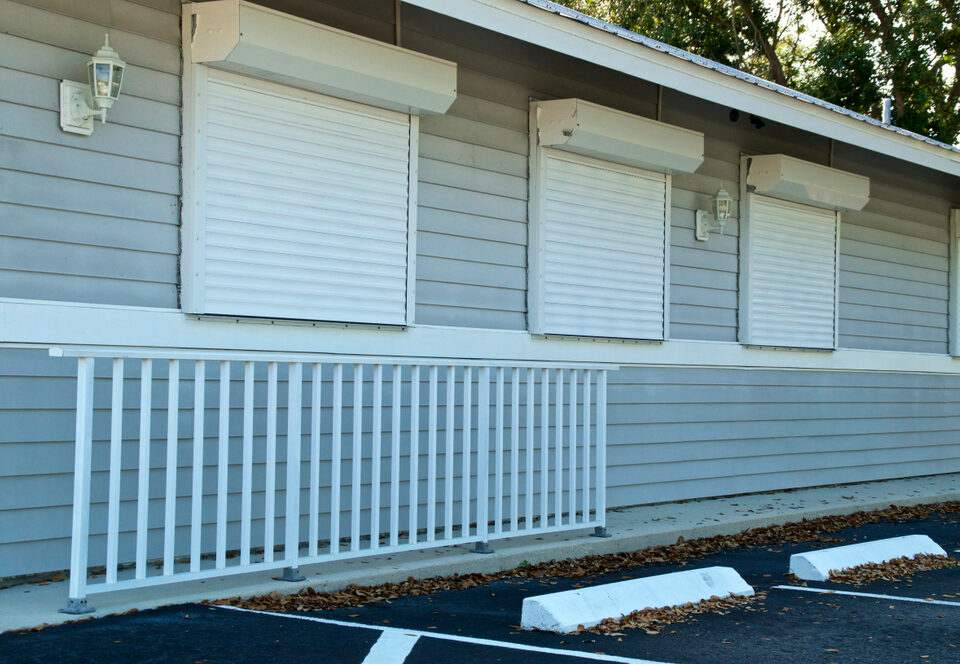 View of a House With Electric Roll Down Hurricane Shutters Installed at the Windows