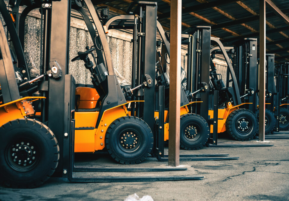 Forklifts Stored In A Warehouse