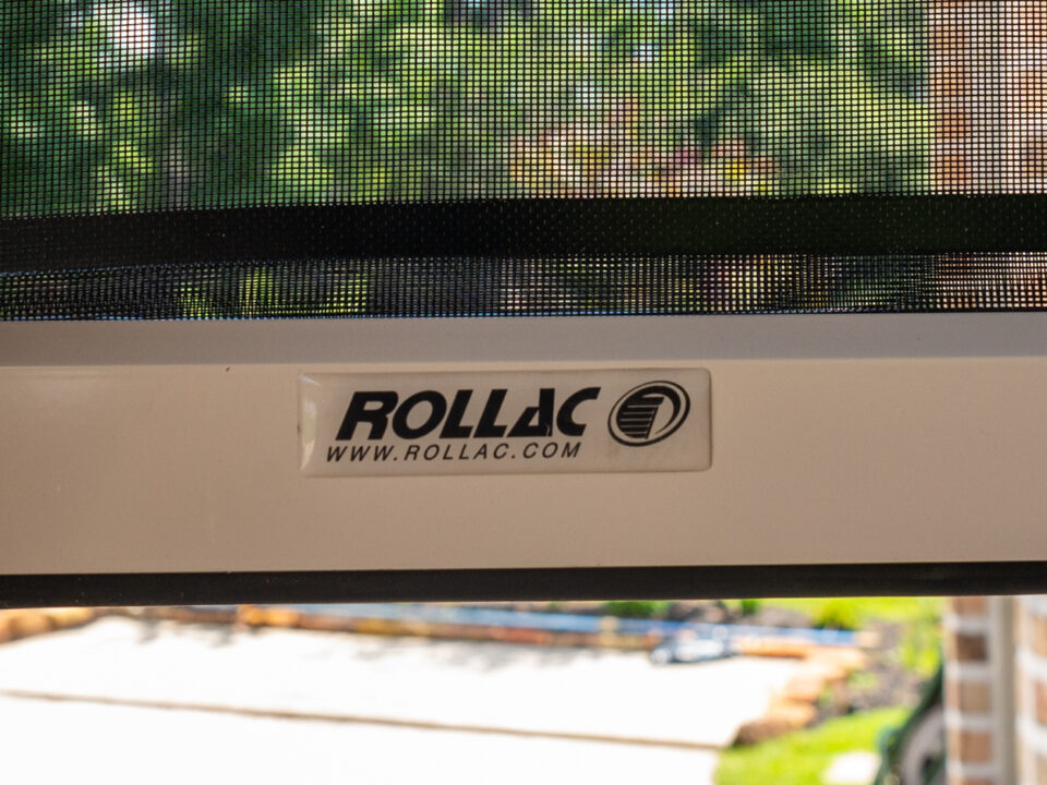 Close Up of Rollac Solar Screen with Brand Name and Logo Sticker