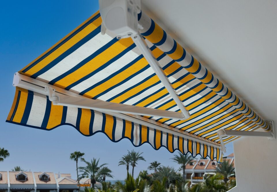 Yellow Blue and White Striped Retractable Awning