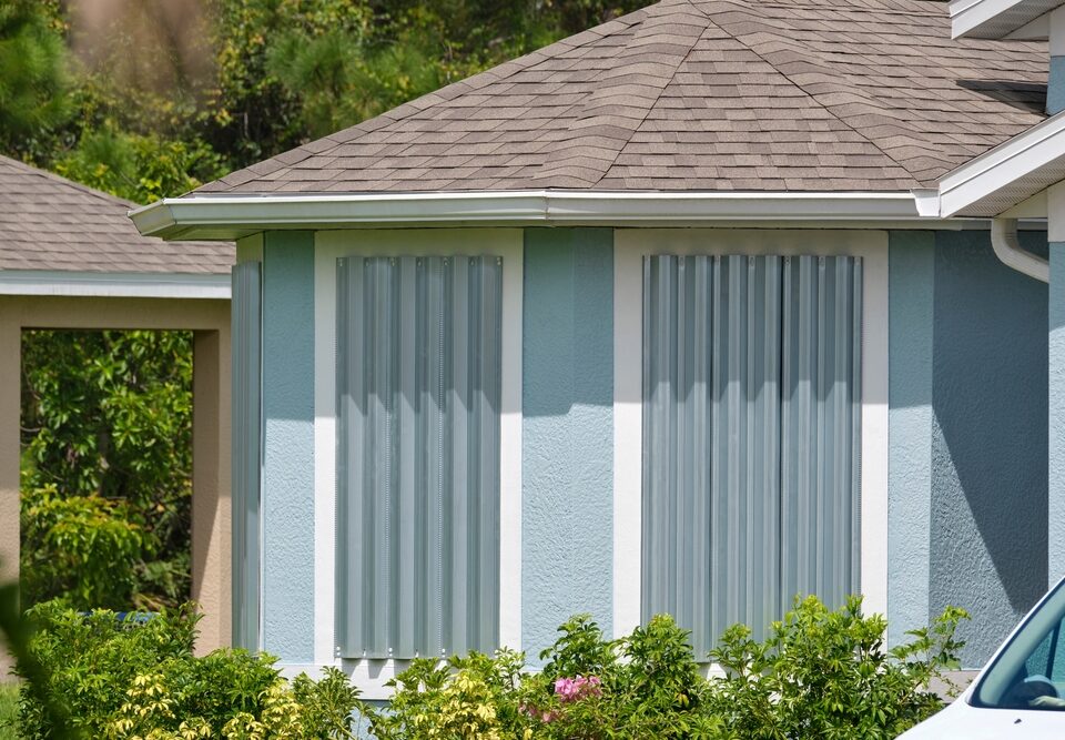 Steel Hurricane Shutters Installed at House Windows as An Affordable Solution